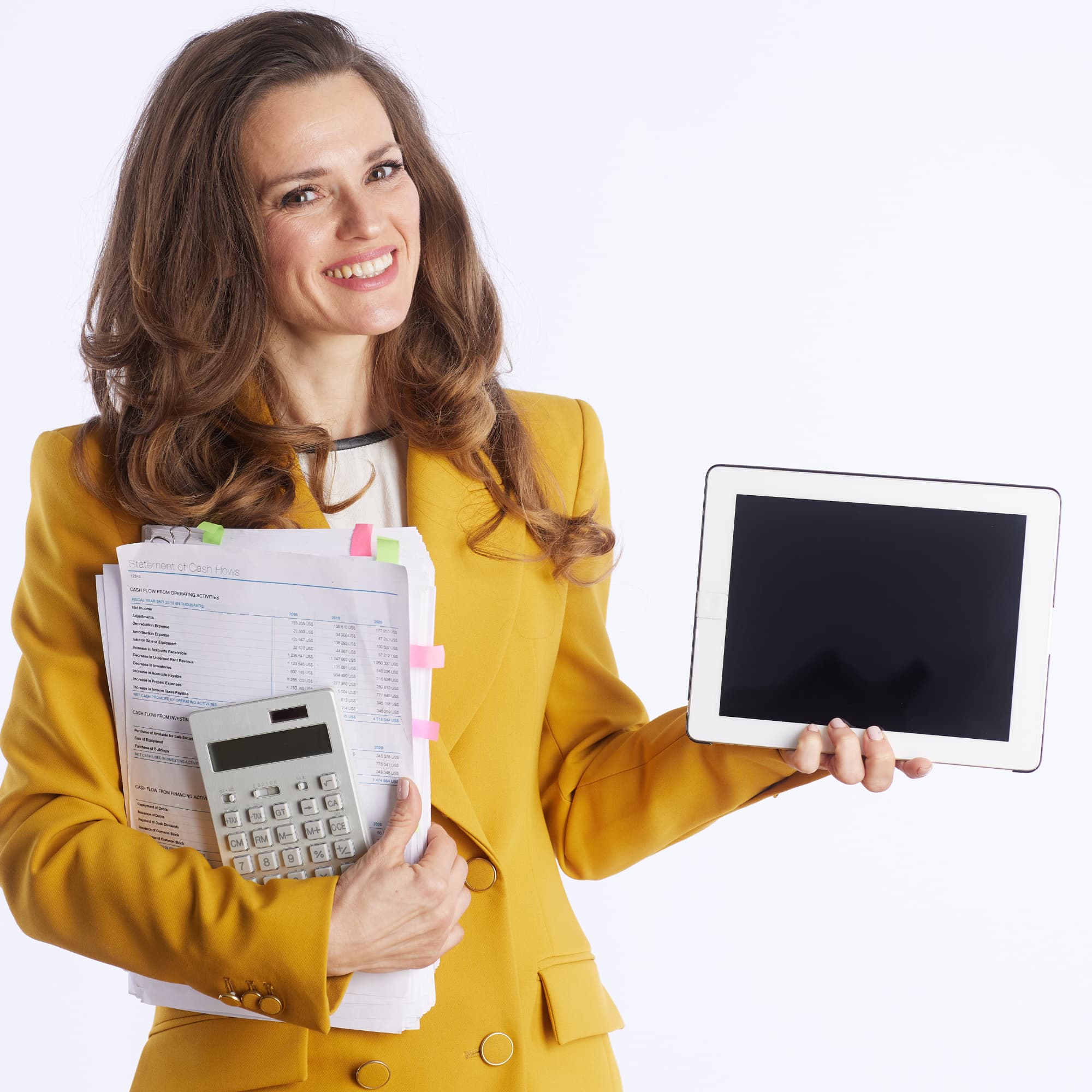 Smiling finance professional in a yellow blazer holding financial documents, a calculator, and a tablet with a blank screen.