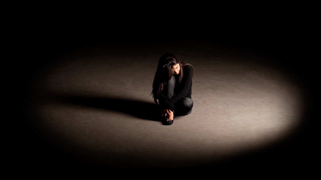 person sitting sad becuase of instagram suspended