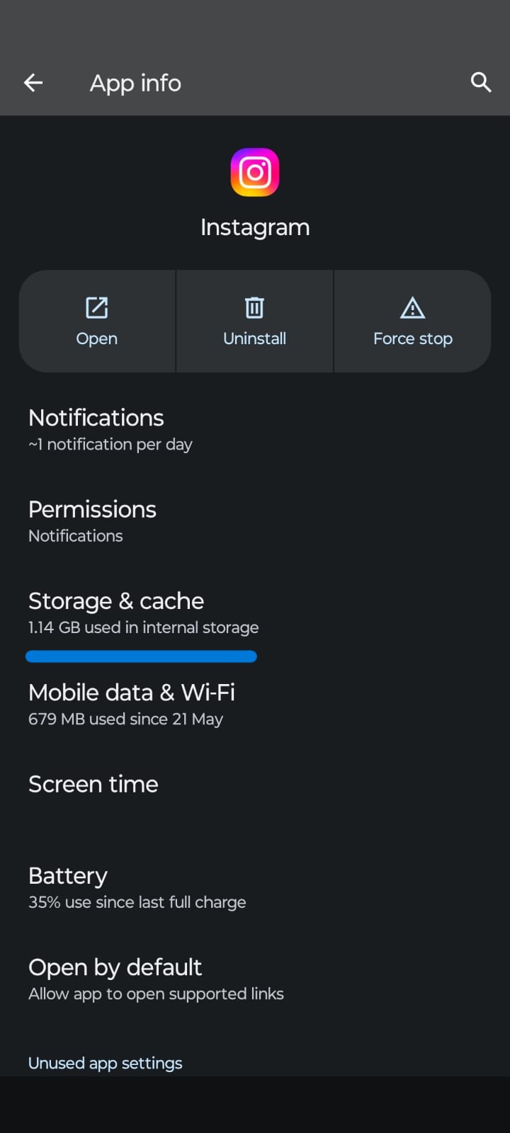 Screenshot of the Android Instagram App Info page in dark mode, showing options such as Open, Uninstall, and Force Stop. The screen also displays settings for Notifications, Permissions, Storage & Cache, Mobile Data & Wi-Fi, Screen Time, Battery, and Open by Default, with the Storage & Cache section highlighted.