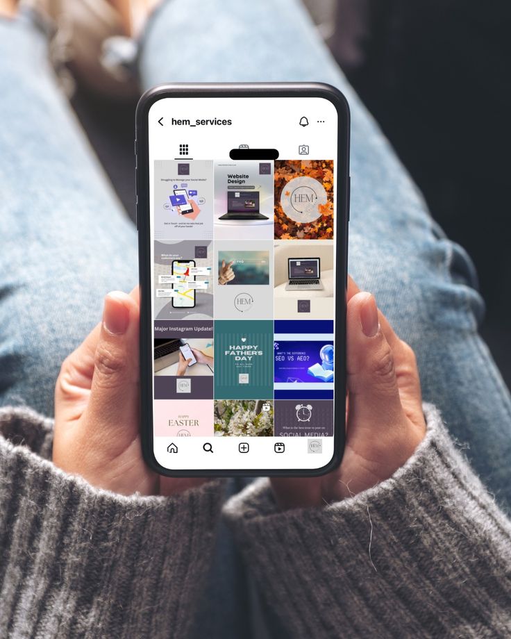 A person's hands hold a smartphone displaying an Instagram business profile for 