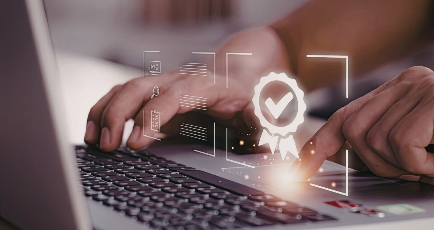 A person's hands are shown typing on a laptop, with a glowing, translucent seal of approval or quality badge icon superimposed over the trackpad. Next to the badge are minimalist interface elements representing checklists and search analytics, symbolizing a focus on quality control, verified results, or SEO excellence in a digital workspace.