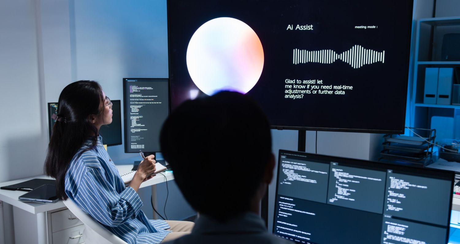 A high-tech workspace showing two people interacting with 