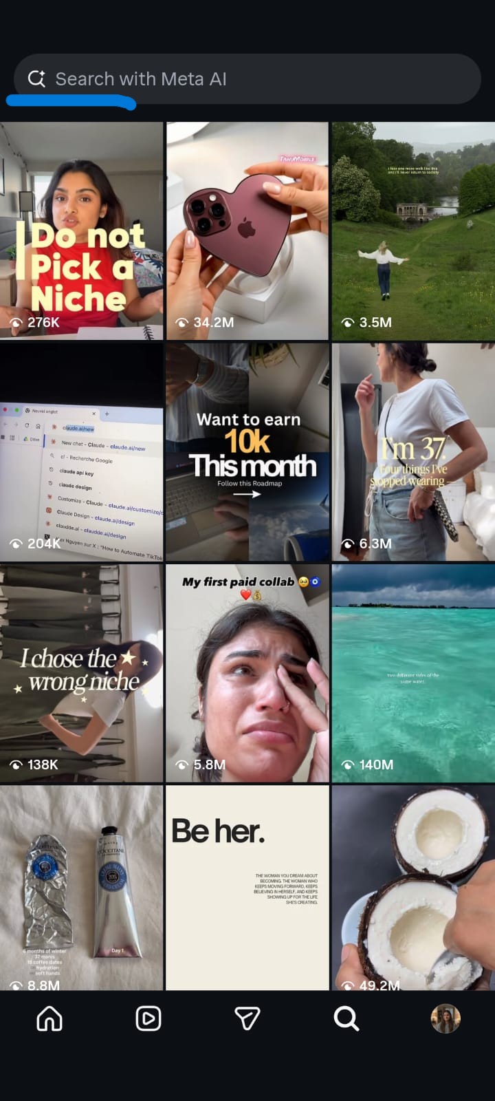 Instagram Explore page in dark mode displaying a grid of trending Reels beneath the Search with Meta AI bar. The feed features videos about content creation, smartphones, AI tools, lifestyle, fashion, travel, beauty products, and motivation, with view counts shown on each thumbnail and the Instagram navigation bar visible at the bottom.