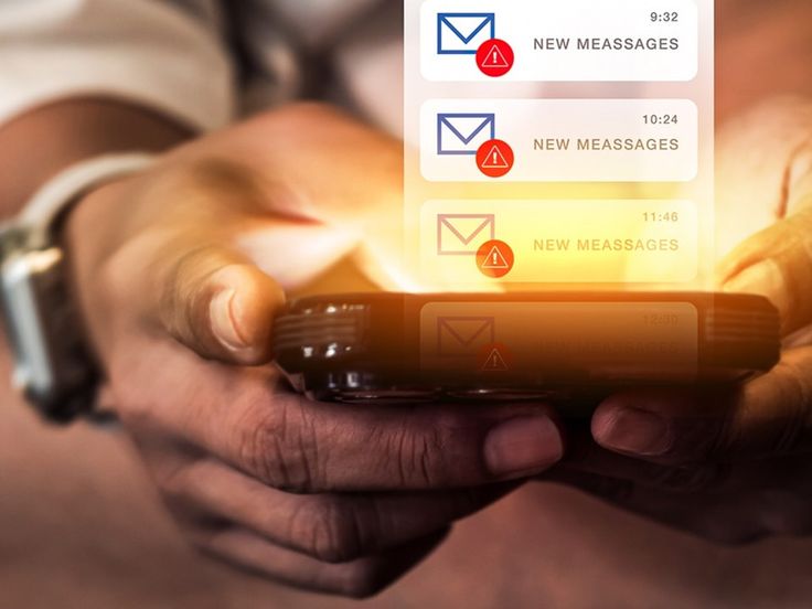 Hands holding a smartphone with multiple glowing 