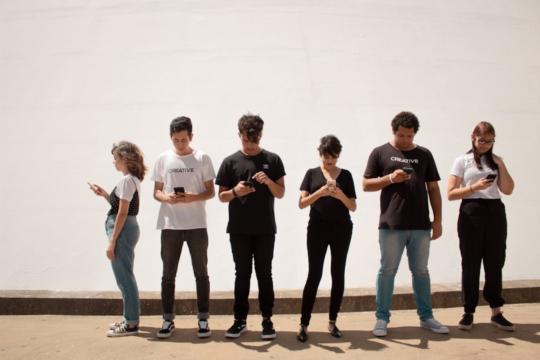 Friends sharing content together on their phones